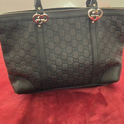 Authentic Gucci brown leather tote bag with heart shaped Gucci logo interlocks