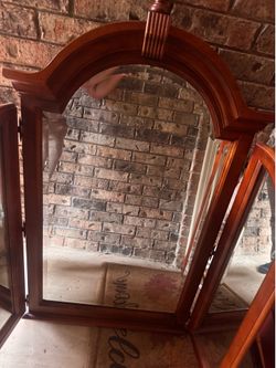 Vintage Broyhill Federal-style tri-fold dresser mirror with a broken arch top and finial