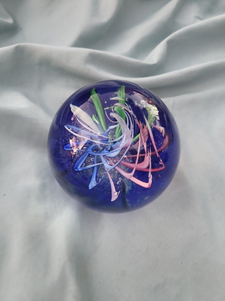  DARK BLUE WITH COLOR SWIRLS INSIDE PAPERWEIGHT.