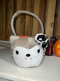 Hello Kitty, vampire Dracula trick-or-treat container basket