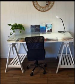 Beautiful desk with glass top to display art, office or school supplies, magazines or books. 59wx28dx30h. Height can be adjusted a bit