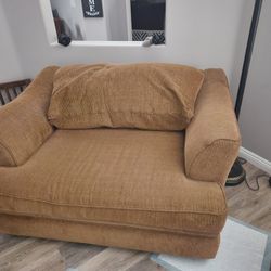 2 couches and swivel chair
