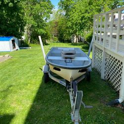 Well- Maintained Boat With Motor and Trailer 