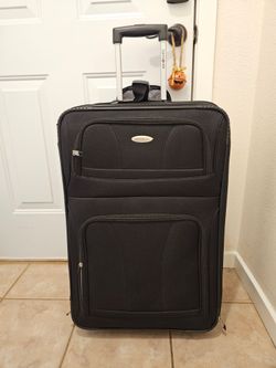 Used black soft sided suitcase with front zipper pocket