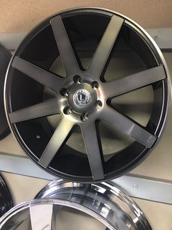 Dark grey machine 22" Luxx 8 wheel/tire package 6x139 se habla español