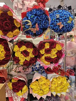 Colorful bouquets available! These have different types like red roses, pink lilies, bright sunflowers, and some cool crochet flowers. Also got a supe