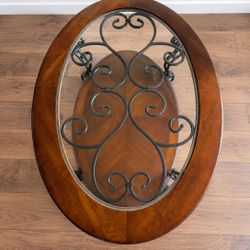 Barely Used Elegant Oval Glass Top Coffee Table with Metal Scrollwork (Photo Pick up only)