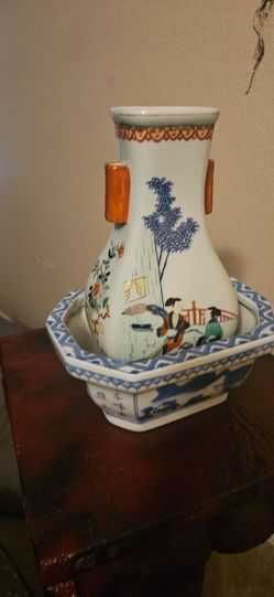 2 Chinese porcelain vessels, both produced in the 80's, one blue and white, and one multi colored