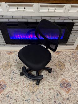 LIKE NEW**Black mesh armless office chair with footrest