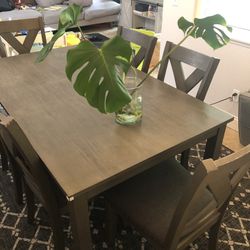 Dining Table With Six Chairs And Carpet 