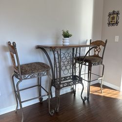 Wood and Iron Pub Table with cushion seating