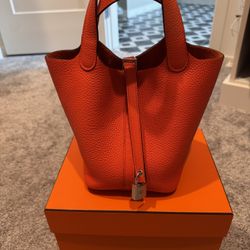 Hermès Picotin Lock 18 in classic Orange poppy. 