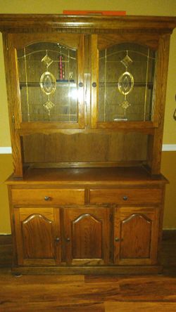 Beautiful china cabinet withh leaded glass doors and lighted upper cabinet.