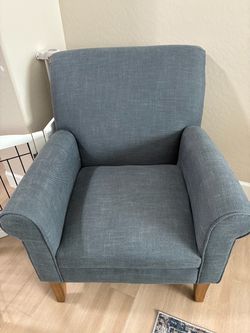 Two blue fabric chairs