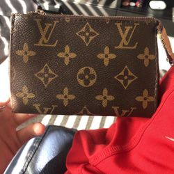 Brown Luis Vuitton coin wallet