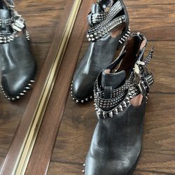 Beautiful black leather booties with silver spikes. Very fashionable. Size 6.5 US
