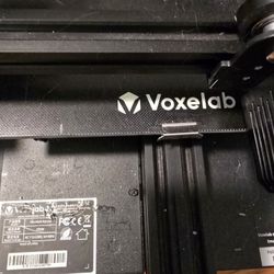 Voxelab Aquila 3D Printer With Black Filament.  