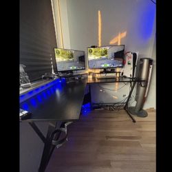 4 foot by 4 foot black desk, and 24inch ASUS moniter.