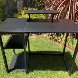 Like new///Black desk with built-in monitor riser & shelves