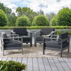 Christopher Knight Home
Coral Outdoor Aluminum
Club Chairs with Open Slat
Design and 6-Inch Thick
Water-Resistant Cushion
(Set of 4) - Dark Grey