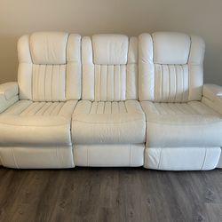 White leather couch and loveseat with recliners, LED cupholders and USB