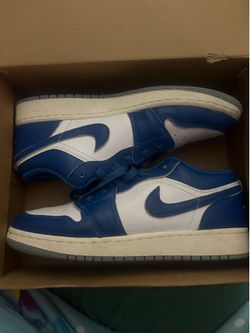 These sneakers appear to be the Nike Air Jordan 1 Low in the "Industrial Blue" colorway