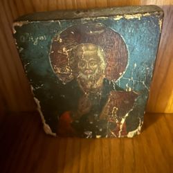 antique Russian icon depicting Saint Nicholas the Wonderworker of Myra.  Icons like this are typically hand-painted in egg tempera on a gesso-coated w