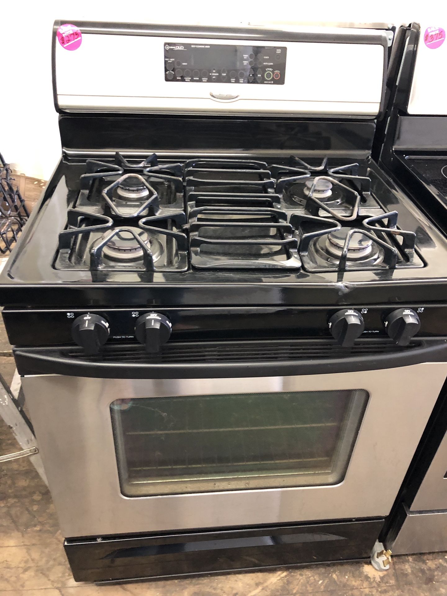 Whirlpool black and stainless steel gas stove