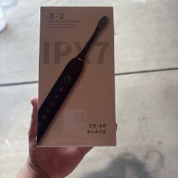 2-1 Sonic Electric Toothbrush Comes With A Black Color And A Pink Color