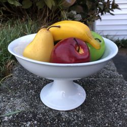 Glass fruit bowl with fake fruit