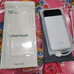 Charmast 10400mAh powerbank model: W1056. 1040mAh Charmast powerbank. Model W1056 white opened box product new with instructions and carrying pouch.