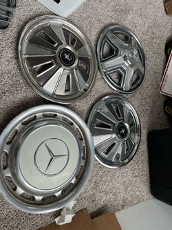 Vintage mustang classic and mercedes hubcaps