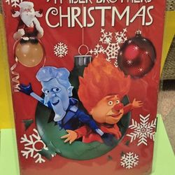 A Year Without Santa Miser Brothers' Christmas Sign Tin 