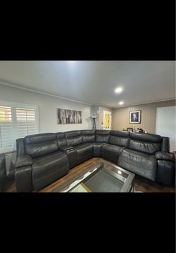 Power reclining sectional with power headrests.