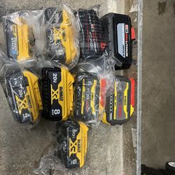 Assorted Milwaukee and DeWalt batteries