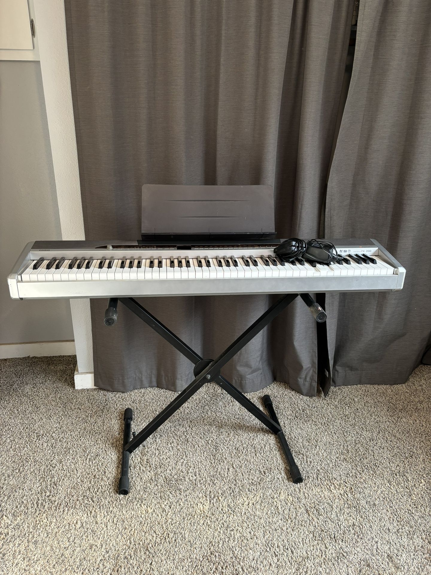 Casio Privia PX-200 Electronic Keyboard With Collapsible Stand, Sheet Music Stand, And Pedal Included