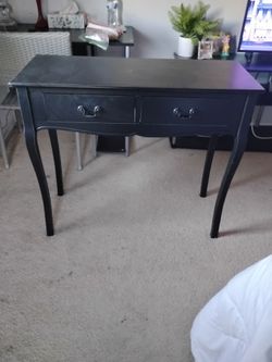 Black table with 2 drawers. New $50.00