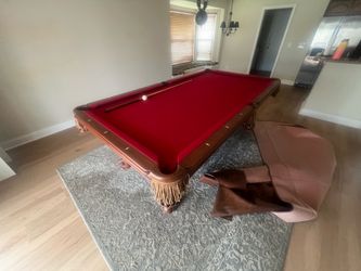 Pool Table with Red Felt and Wood Frame