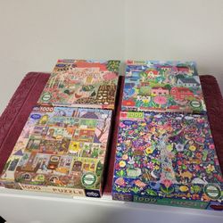 FOUR EEBOO BRAND PUZZLES WITH PUZZLE KEEPER