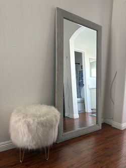 Mirror with plush chair