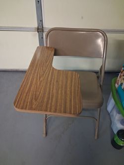 Beige metal Chair with miny brownish wood table good for zoo meetings or schoolwork