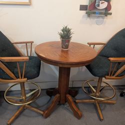 2 Swivel Bar Stools and a Bar Table