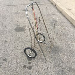 A GROCERY SHOPPING CART /LAUNDRY CART WITH TWO BUNGEE CORDS LITE WEIGHT AND STURDY FOLDS FLAT USED IN GOOD CONDITION $20.00