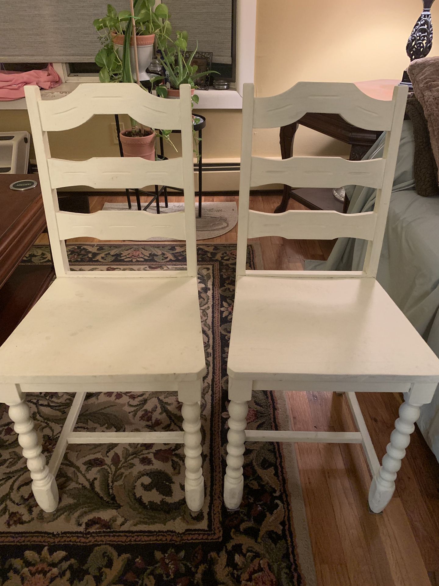 Two wooden farmhouse chairs