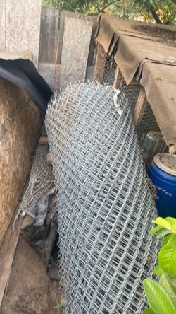 A roll of chain link fence