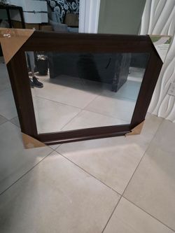Beveled mirror with mahogany frame