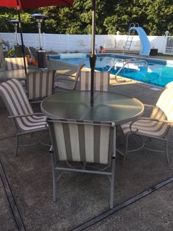 Table and 4 chairs and umbrella