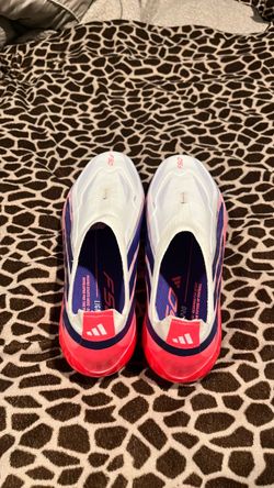 F50 HYPERFAST ELITE LACELESS FIRM GROUND CLEATS