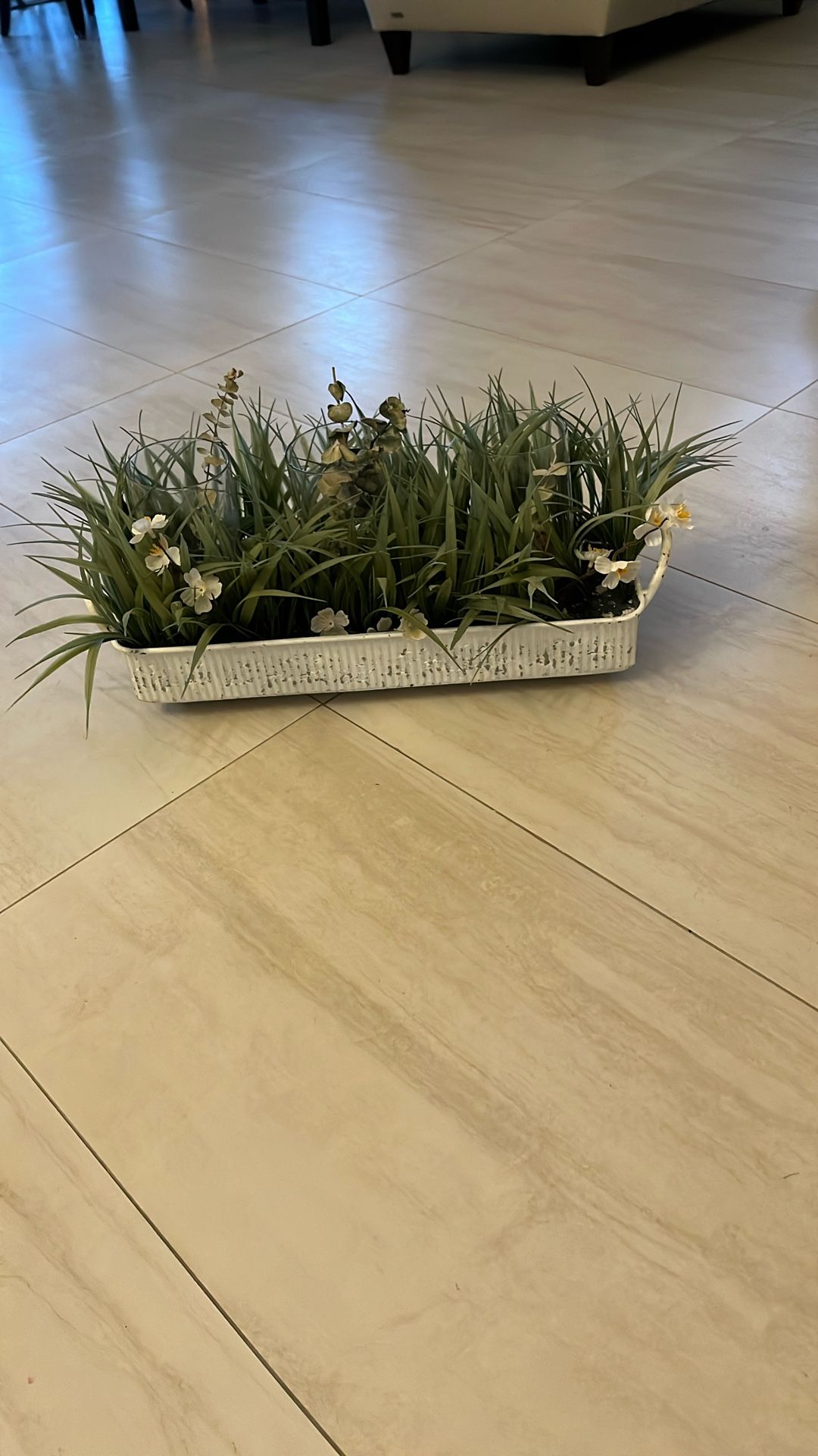 Silk flowers and three glass tube vases in white washed metal tray