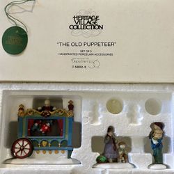 Dept. 56 Heritage Village Collection – Village Accessories “THE OLD PUPPETEER” – Set of 3 Hand-painted porcelain.
